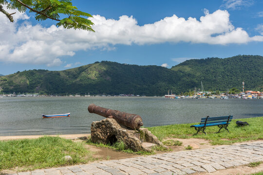 Old bronze cannon on seashore, Paraty, Costa Verde, Brazil