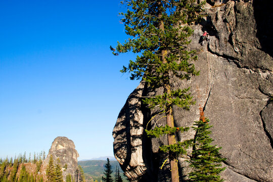 A male rock climber ascends a route in the traditional style, Lolo, Idaho.