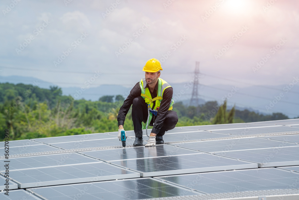Poster engineer using dril installing solar cell on roof factory,environment friendly,alternative energy to