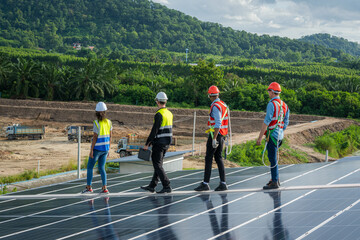 Engineer maintenance checking installing solar roof panel on the factory rooftop,Survey check solar panel roof.