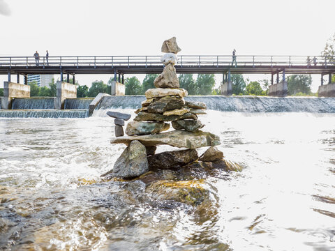 Stack of rocks balancing in Isar river, Bavaria, Germany