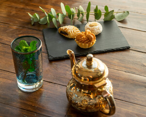 variety of biscuit over bowl an arabic teahouse. Accompanied with a chocolate cake