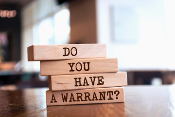 Wooden blocks with words 'Do You Have a Warrant?'.