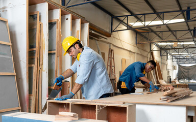 Male carpenter working with skill in carpentry workshop. Professional joiner work with manual tool...