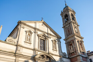 Façade and bell tower of Basilica di Santo Stefano Maggiore, church estabilished in 5th century, in Milan city center, Lombardia region, Italy 
