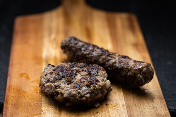 Bulgarian barbeque: Kufte - usually larger and round in shape while Kebapche is smaller and cylindrical. Both are often served as a main course or as a snack, typically with a side of fries or bread.