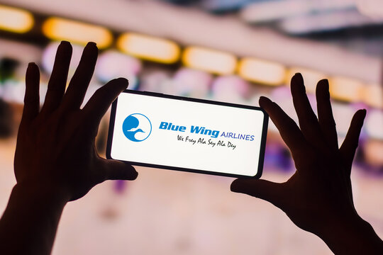 January 19, 2023, Brazil. In this photo illustration, the Blue Wing Airlines logo is displayed on a smartphone screen. It is an airline based at Zorg en Hoop airport in Paramaribo, Suriname.