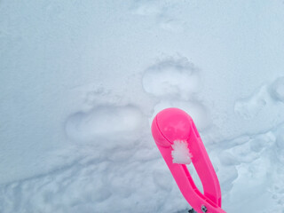 pink snowball maker make balls out of snow. accessories and toys for winter games.