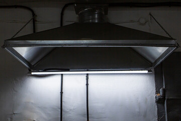 close-up of exhaust hoods in hazardous production, together with an air removal system,...