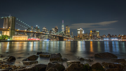 Classic view of Brooklyn Bridge and Manhattan from Pebble Beach in Brooklyn
