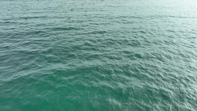 4k drone video flight over ocean, sea. Close to the water