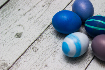 Blue Easter Eggs on old white wood background
