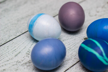 Blue Easter Eggs on old white wood background