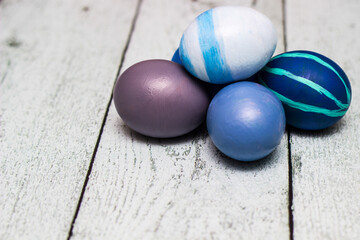 Blue Easter Eggs on old white wood background
