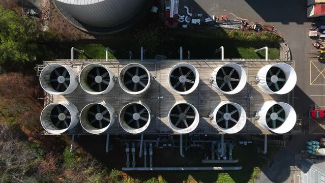 HVAC heating ventilation energy consumption theme. Rising aerial of power plant and system for large commercial buildings.
