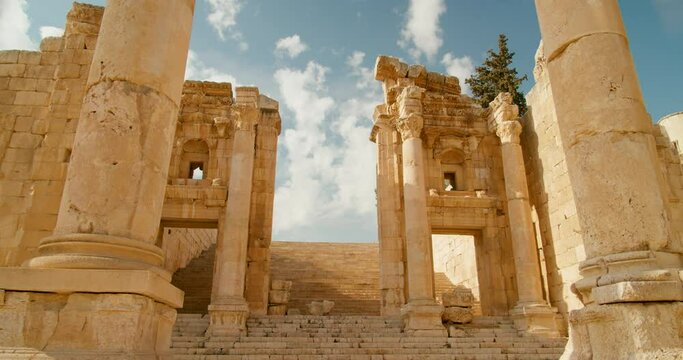 Establishing side of Artemis Temple Esplanade with columns in front in Jerash, Jordan. Ancient sanctuary and former Roman ruins and one of Seven Wonders. Antique architecture. 4k orbit shot