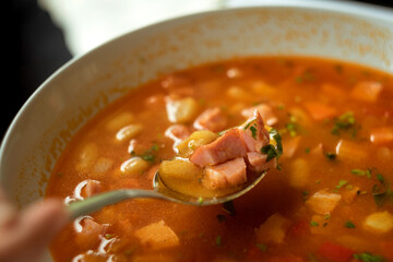 Traditional Romanian bowl of bean and smoked pork soup