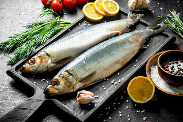 Salted herring with lemon, dill and spices.