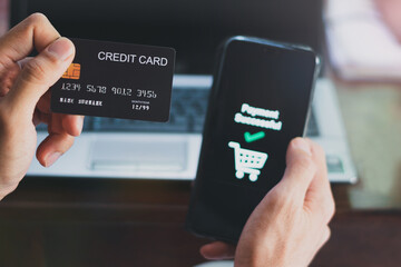 Man 's hand using mobile smart phone, online payment, Internet banking.