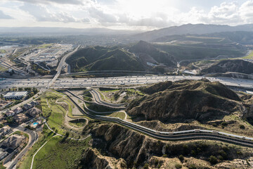 Aerial view of the Interstate 5 freeway and Los Angeles aqueduct cascades near Mission Hills and Newhall in Southern California.  