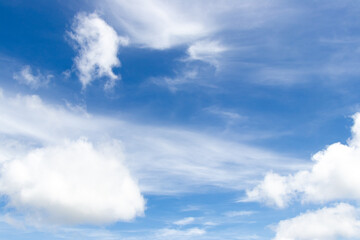 Blue color sky with white fluffy cloud background