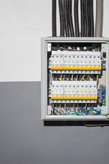 Switchboard equipment. Shield for enterprise electrification. Switchboard for control over electrical equipment. Labeled panel with wires and switches at the enterprise