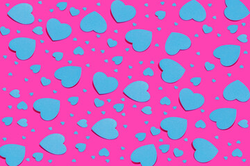 Minimal love, Valentine's Day idea. Seamless pattern of blue hearts on vivid pink background.