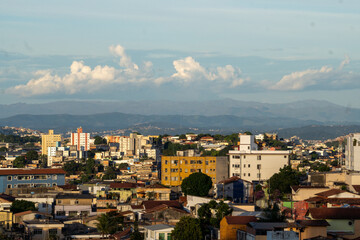 Fototapeta premium Amazing metropole with houses on small hills and horizon with mountains