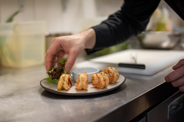 man chef cooking fried shrimp on kitchen