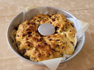 bread with cubes of sausage still in the mold
