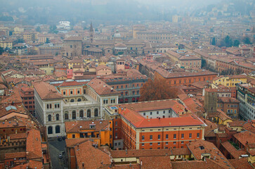 Mysterious foggy high perspective view from the tower on Bologna old town center. Old buildings...