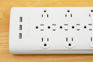 Surge protector with USB protection on wood desk