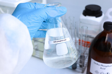 ortho phosphoric acid in bottle , chemical in the laboratory and industry