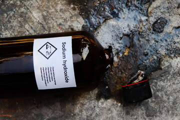 sodium hydroxide are leaking on the floor, chemical in the laboratory and industry