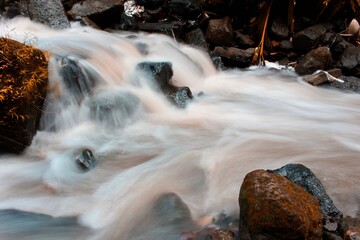 This is a beautiful photo of a stream of water flowing in a river in the village area.