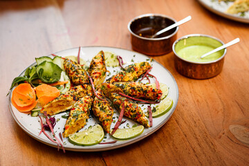 Chicken rolls prepared according to an Indian recipe.