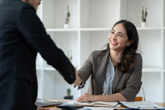 Two Asian businesswomen showing joy and shake and Cheerful Success with New job offer, job promotion. Management. Performance, management concept.