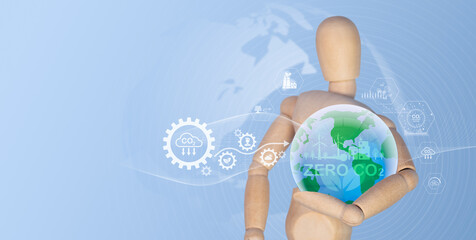 The circular economy concept. In one hand, a globe is held, surrounded by a circular economy emblem. Reusable design and renewable material resources for corporate expansion