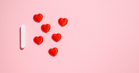 Many small hearts on a pink background. Congratulations on February 14th.