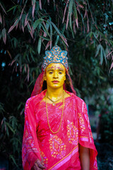 Hindu religious village people celebrating gajan festival wearing colourful costumes