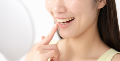 Obraz premium 綺麗な歯並びの女性 顔なし