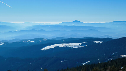 Scenic view of alpine meadows, high altitude forest and hills seen from hiking trail to Ladinger...