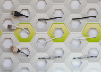 Obraz na płótnie Canvas Grey, white and black USB connectors on white and green honeycomb background