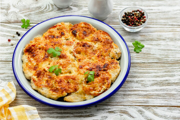 Vegetarian breakfast casserole on wooden background. Top view, copy space, flat lay.