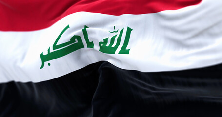 Close-up view of the Iraq national flag waving in the wind