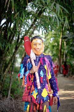 Hindu religious village people celebrating gajan festival wearing colourful costumes