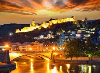 Fototapeta na wymiar Dramatic sunset over the old town of Tbilisi