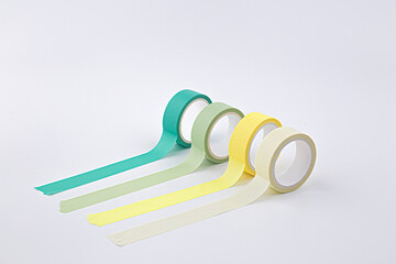 colorful masking tape rolls background on white
