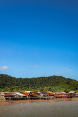 Obraz premium Koh Lanta Old Town seen from the sea on a sunny day. Ko Lanta, Krabi, Thailand