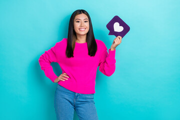 Photo of adorable positive lady blogger wear pink stylish outfit promoting modern devices isolated on cyan color background